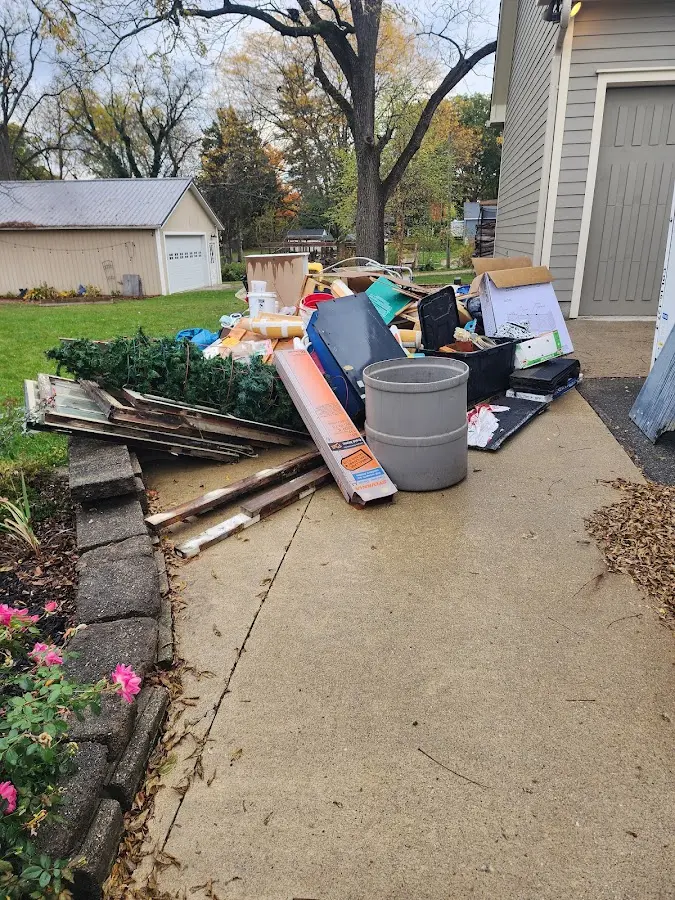 Dumpster being loaded with debris for Estate Cleanout Dumpster Rental in Hounsfield